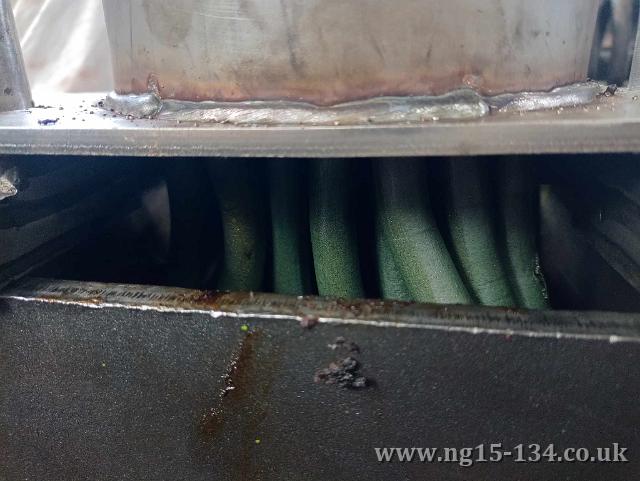 The grease 'candles' coming out of the extruder. (Photo: Laurence Armstrong)