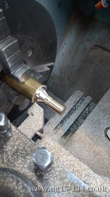 A bolt to mount the number plate being made in the lathe. (Photo: Erle Ford)
